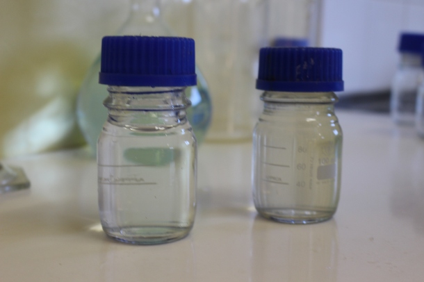 Samples of water at the Waainek water treatment works before treatment (right) and after treatment (left). Pic: Emily Corke. 